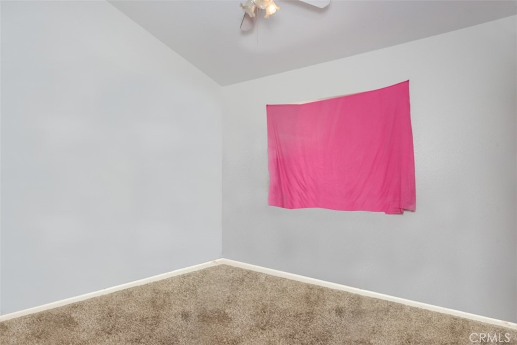 13365 Cloudburst Drive Corona, CA 92883 - Photo 8 of 21 a room with red walls and a window
