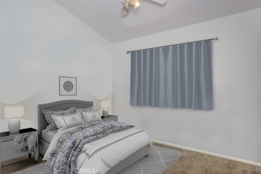 13365 Cloudburst Drive Corona, CA 92883 - Photo 9 of 21 a bedroom with a bed and a chandelier fan