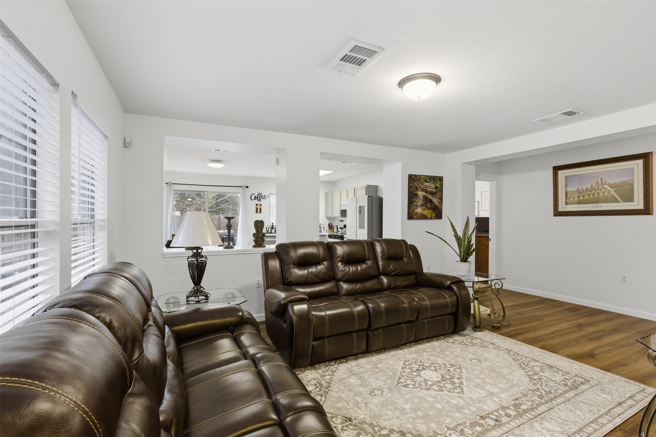 7536 Marble Ridge Drive Austin, TX 78747 - Photo 12 of 30 Living room featuring wood finished floors and baseboards