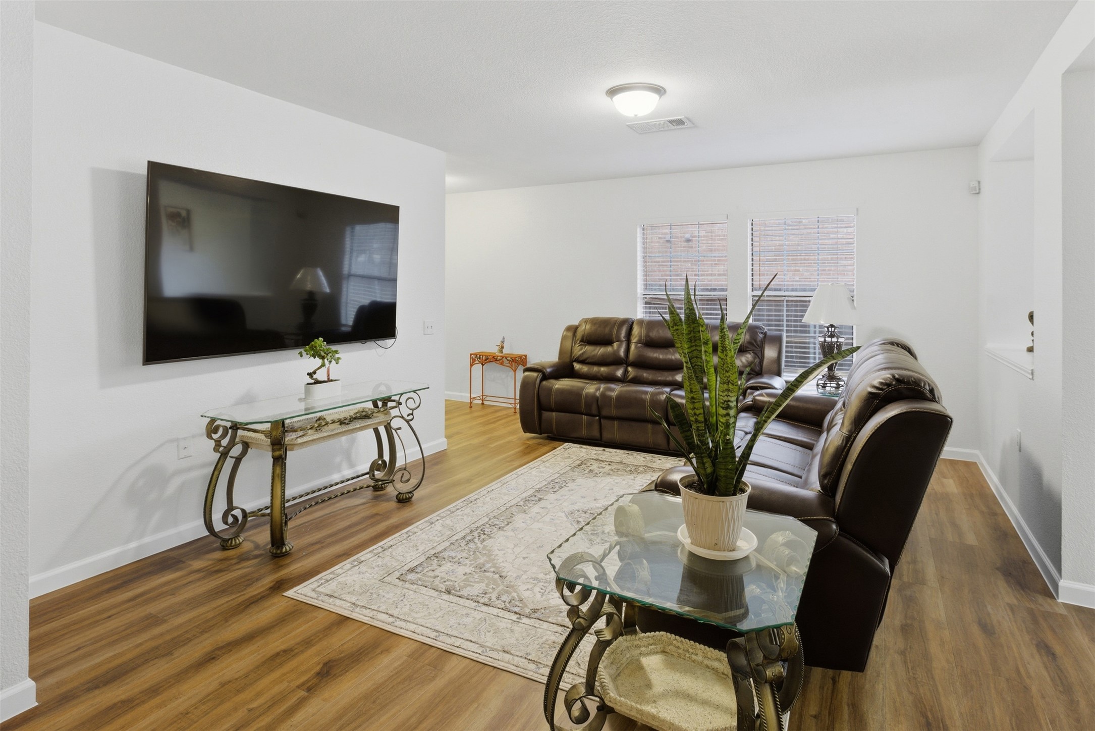 7536 Marble Ridge Drive Austin, TX 78747 - Photo 15 of 30 Living area featuring wood finished floors and baseboards