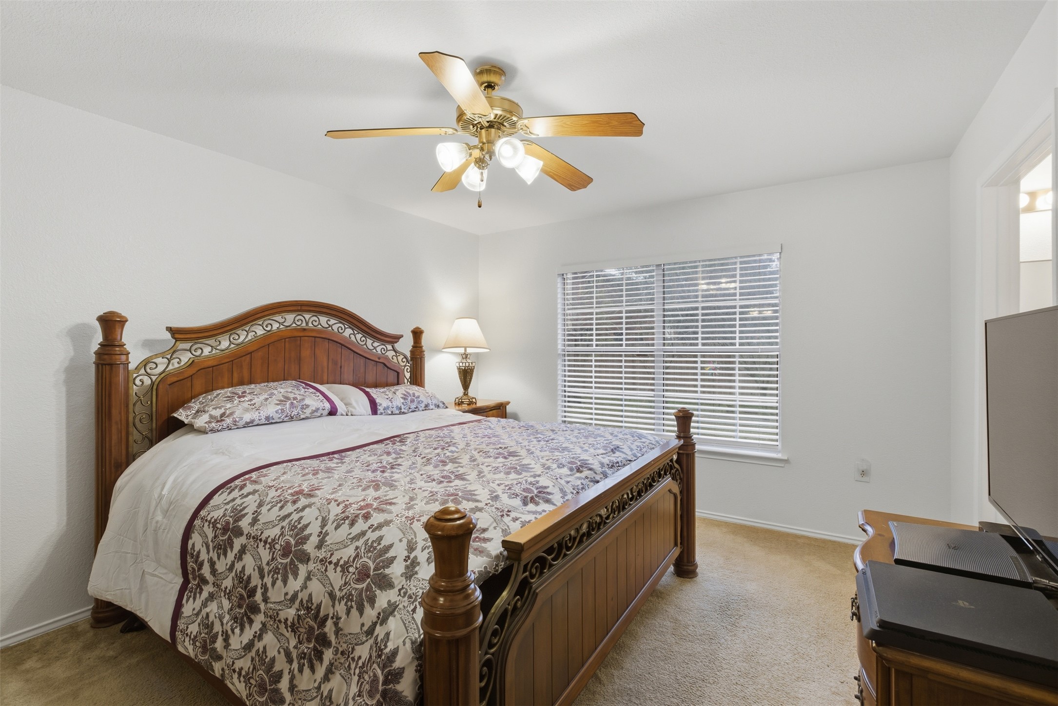 7536 Marble Ridge Drive Austin, TX 78747 - Photo 20 of 30 Bedroom featuring ceiling fan and light colored carpet