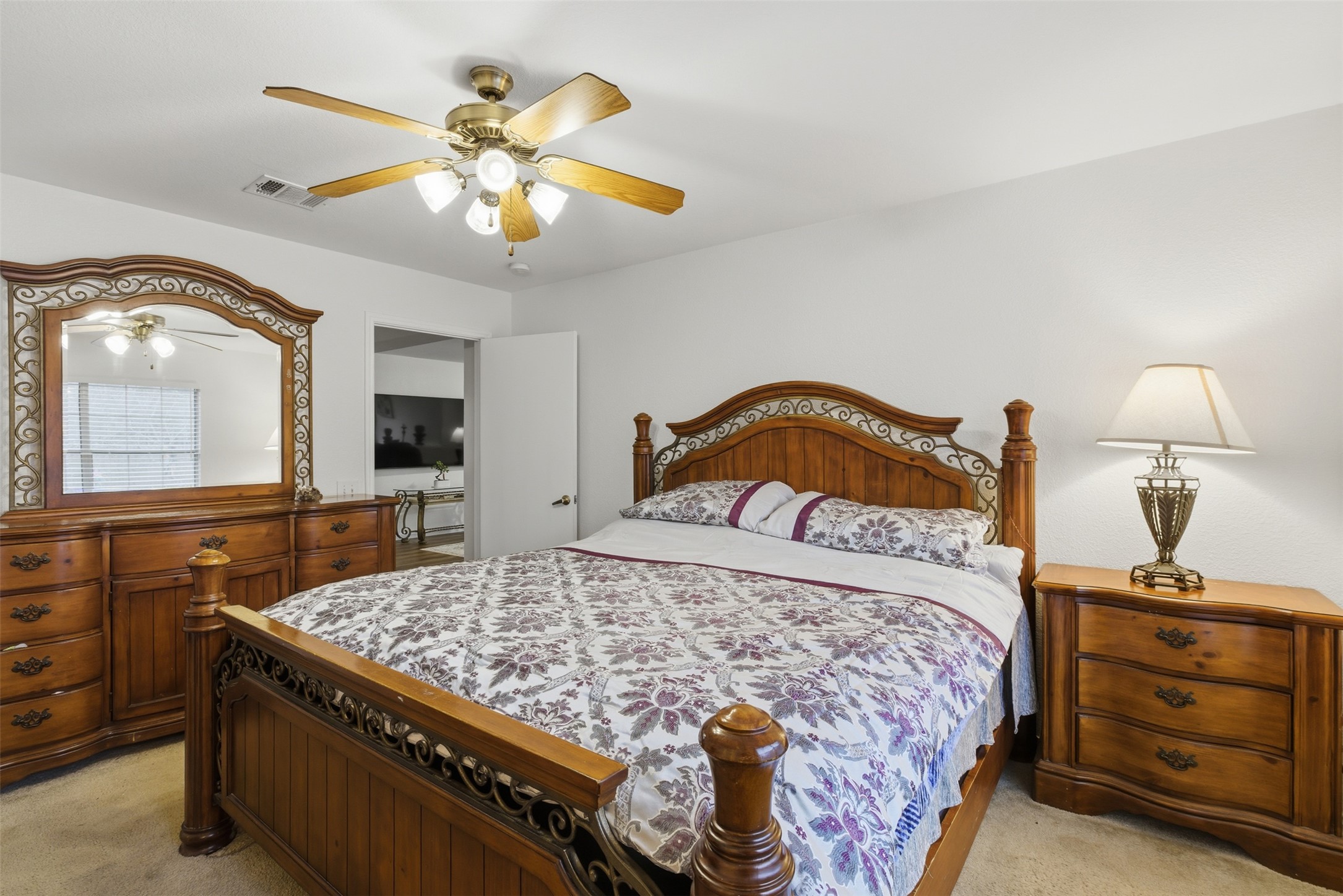 7536 Marble Ridge Drive Austin, TX 78747 - Photo 21 of 30 Bedroom featuring light colored carpet and a ceiling fan