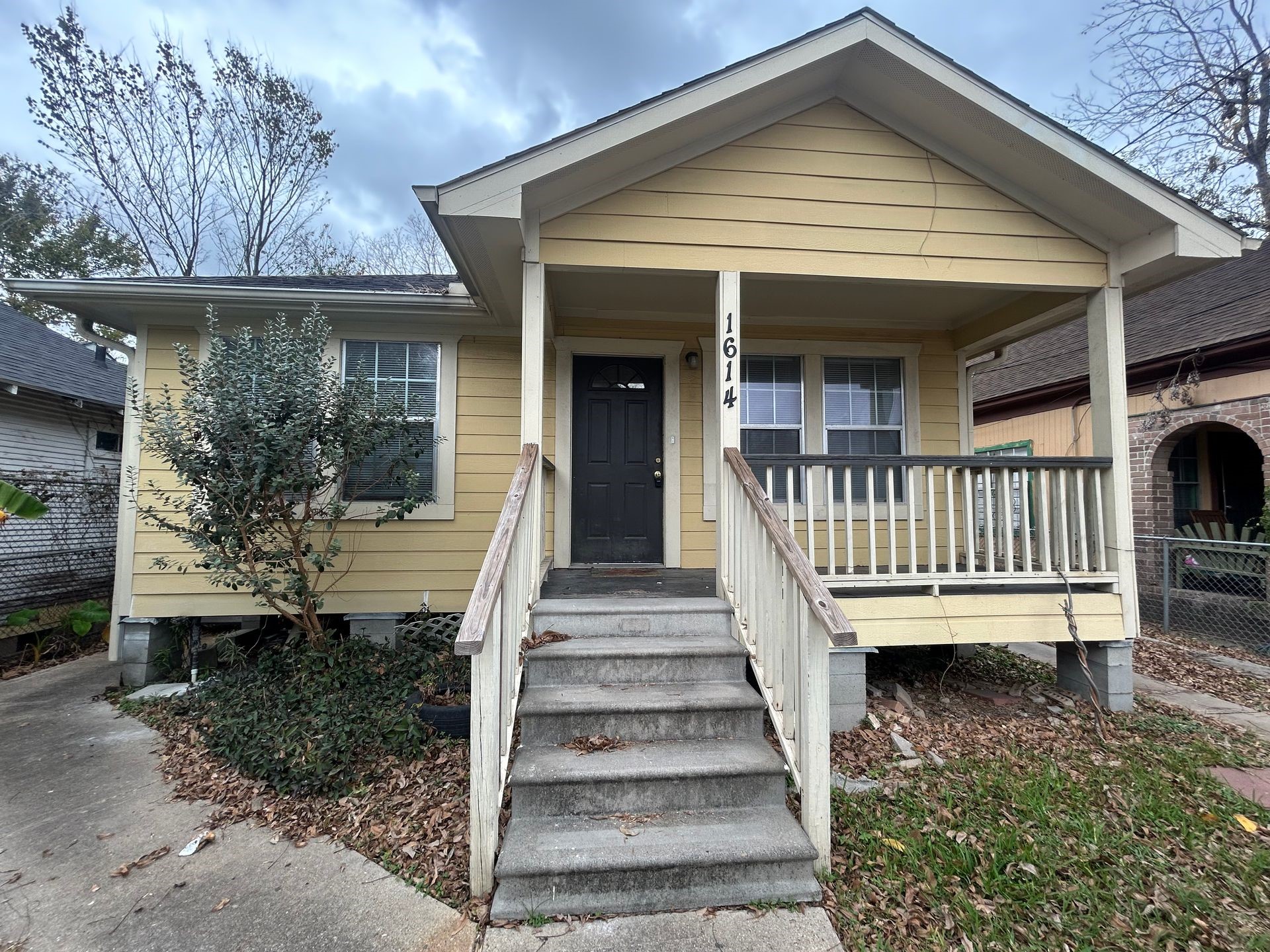 a front view of a house with a porch