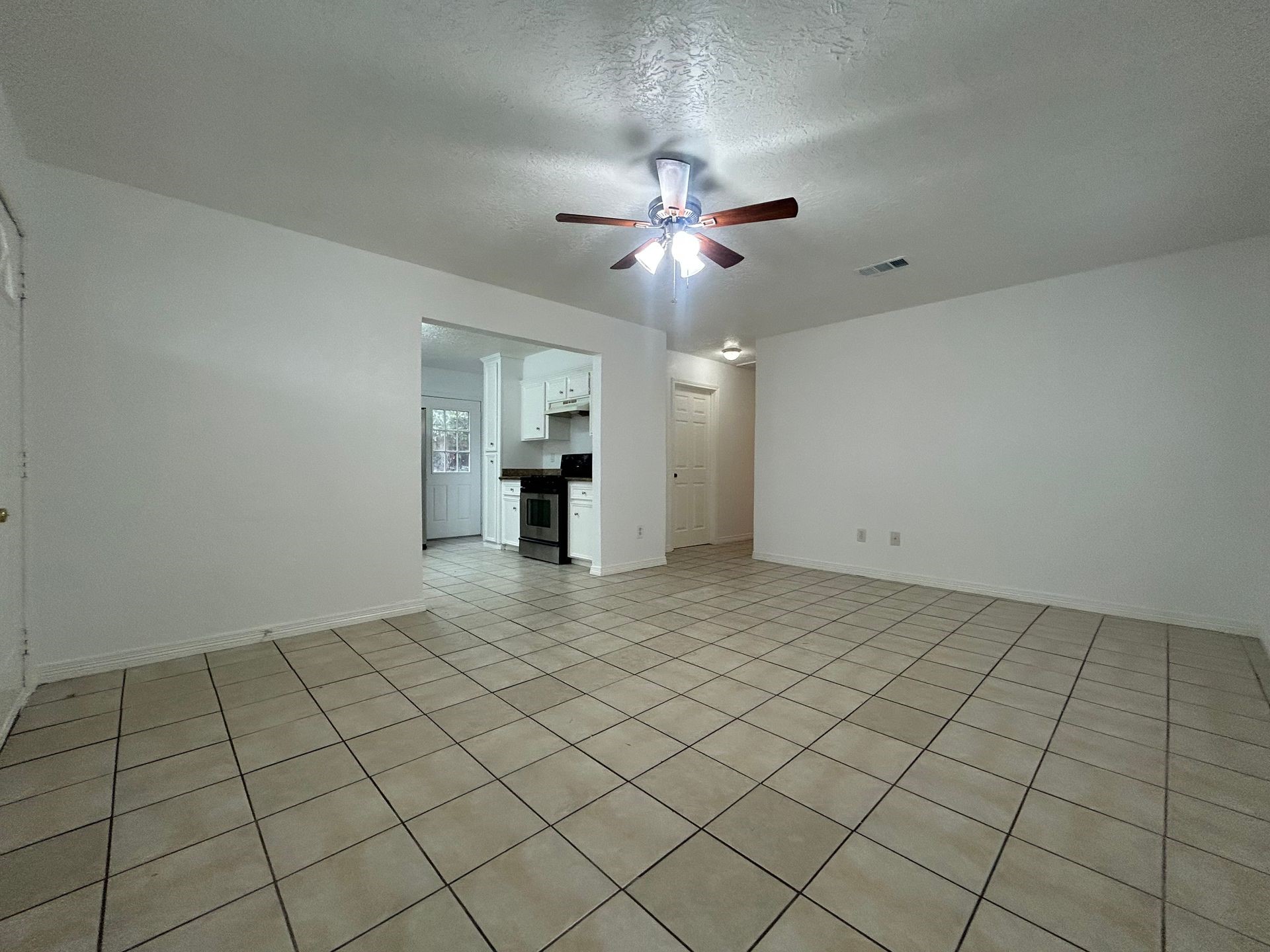 1614 Common Street Houston, TX 77009 - Photo 5 of 13 a view of an empty room and chandelier fan