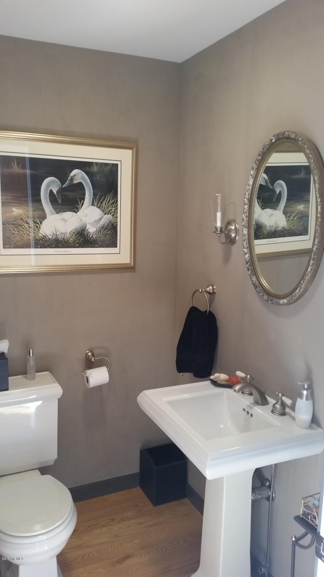116 Otis Road Becket, MA 01223 - Photo 20 of 29 a bathroom with a toilet a sink and mirror