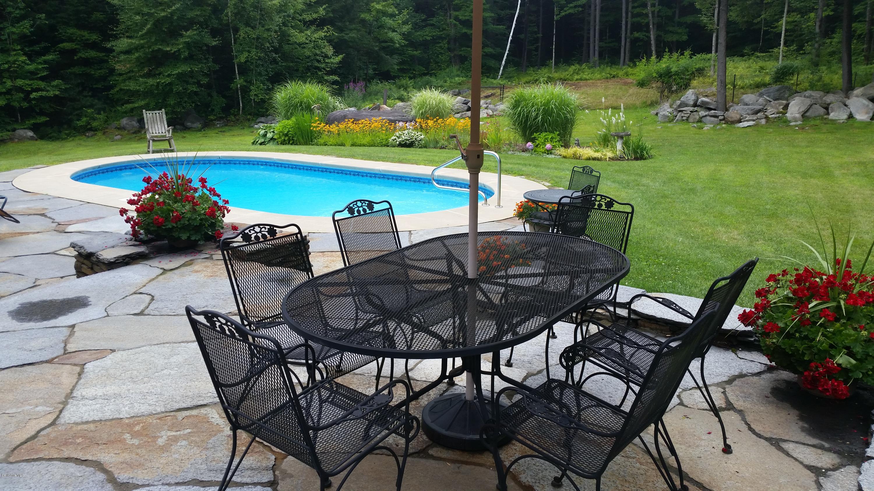 116 Otis Road Becket, MA 01223 - Photo 3 of 29 a view of a chairs and table in patio with a yard