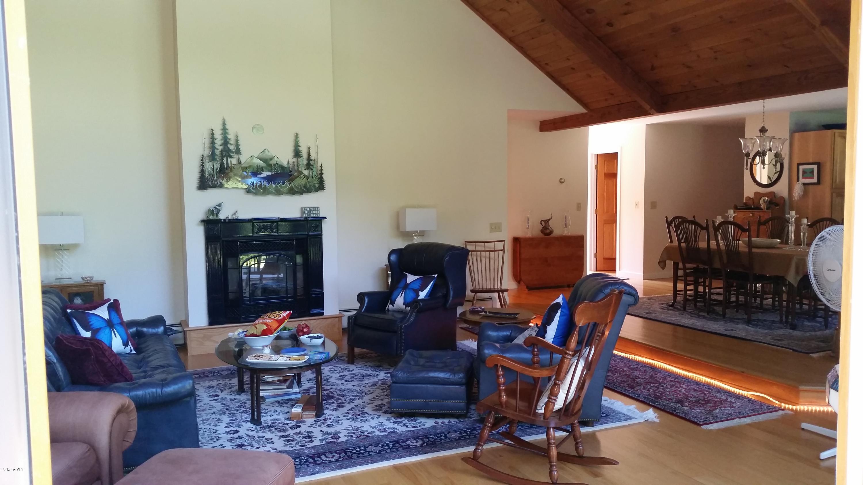 116 Otis Road Becket, MA 01223 - Photo 7 of 29 a living room with furniture and a fireplace