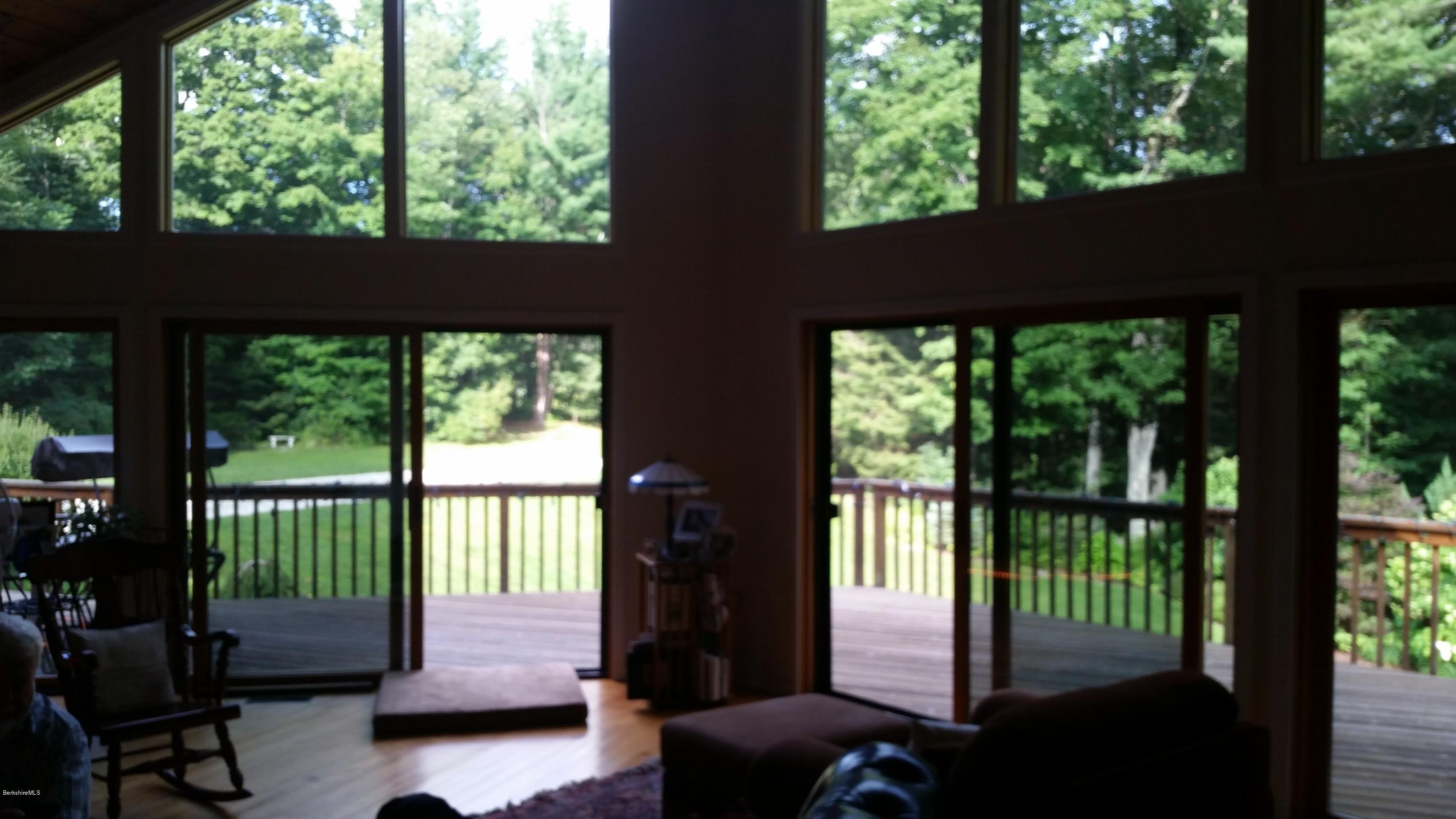 116 Otis Road Becket, MA 01223 - Photo 10 of 29 a view of a two chairs in the balcony