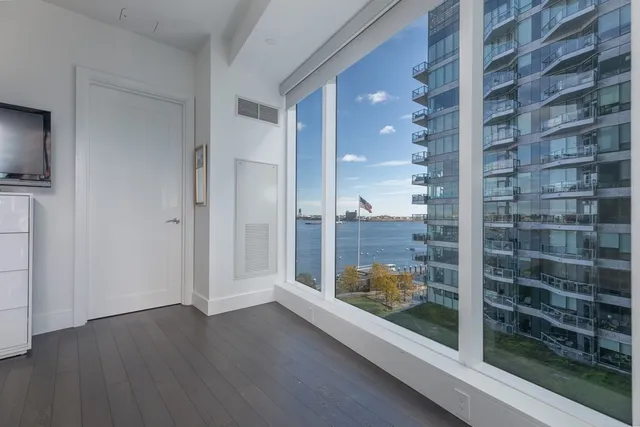 a view of a room with a glass door