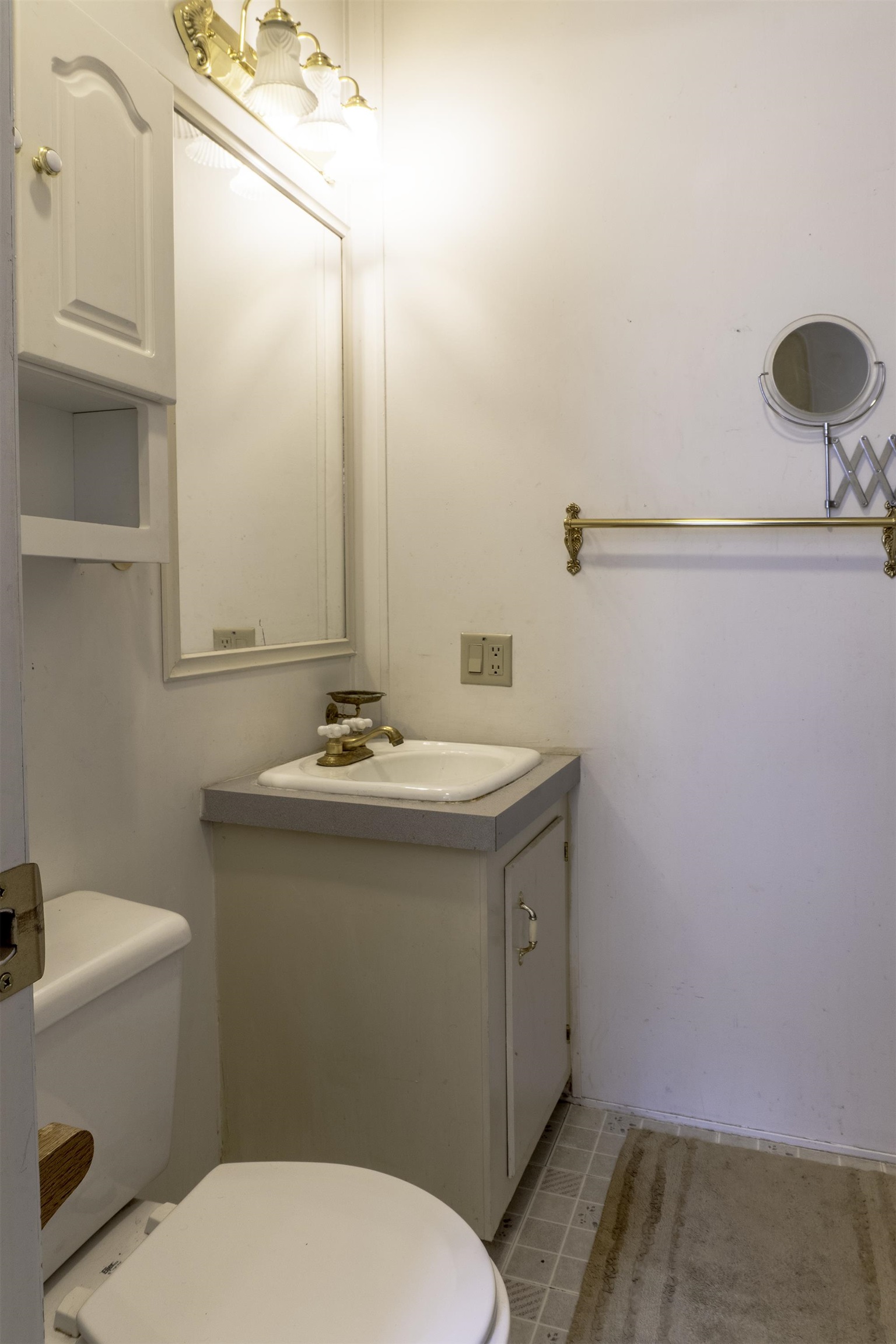18 Eagle-Peak Bridgeport, CA 93517 - Photo 13 of 45 a bathroom with a sink a toilet and mirror