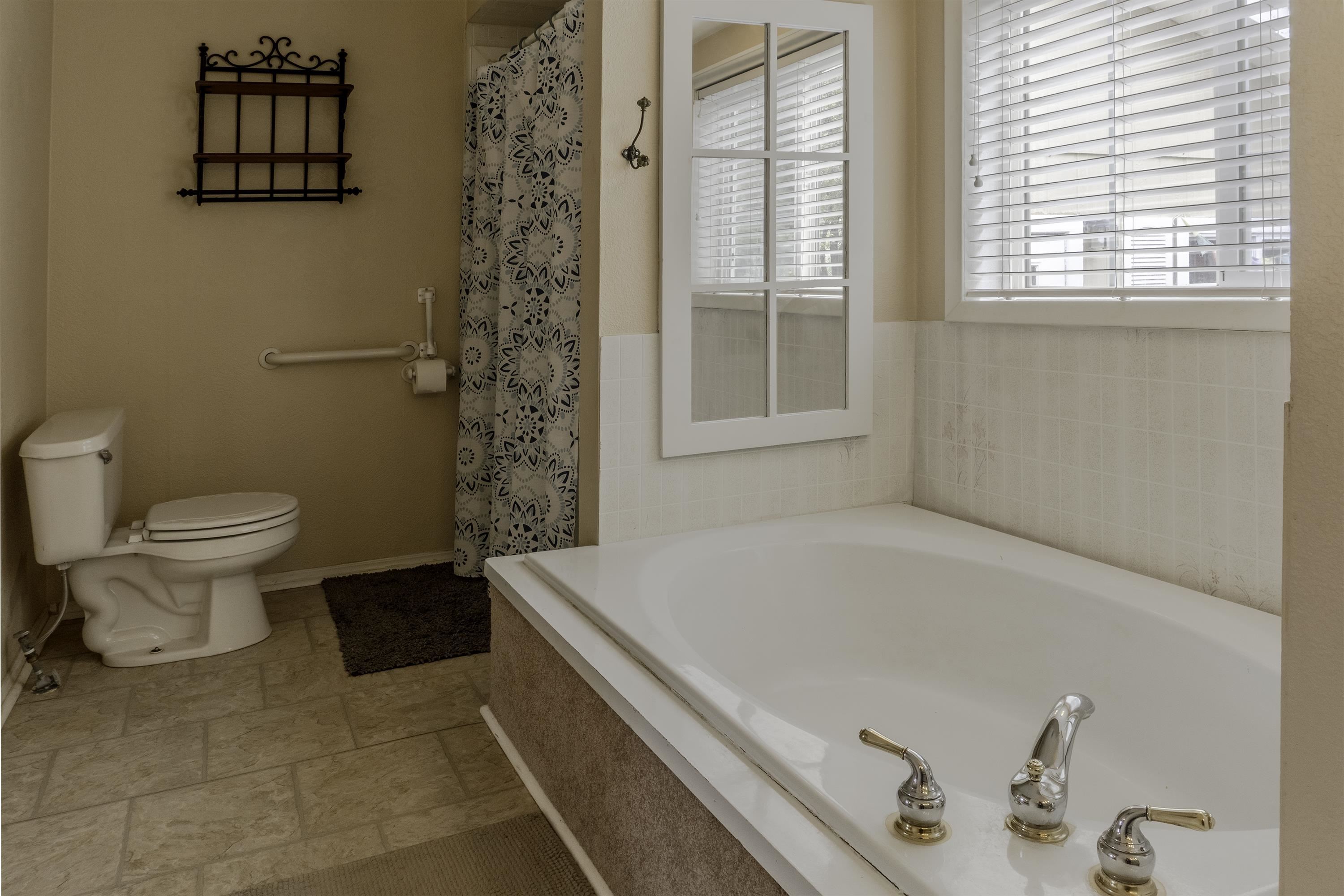 18 Eagle-Peak Bridgeport, CA 93517 - Photo 18 of 45 a bathroom with a bathtub and a toilet