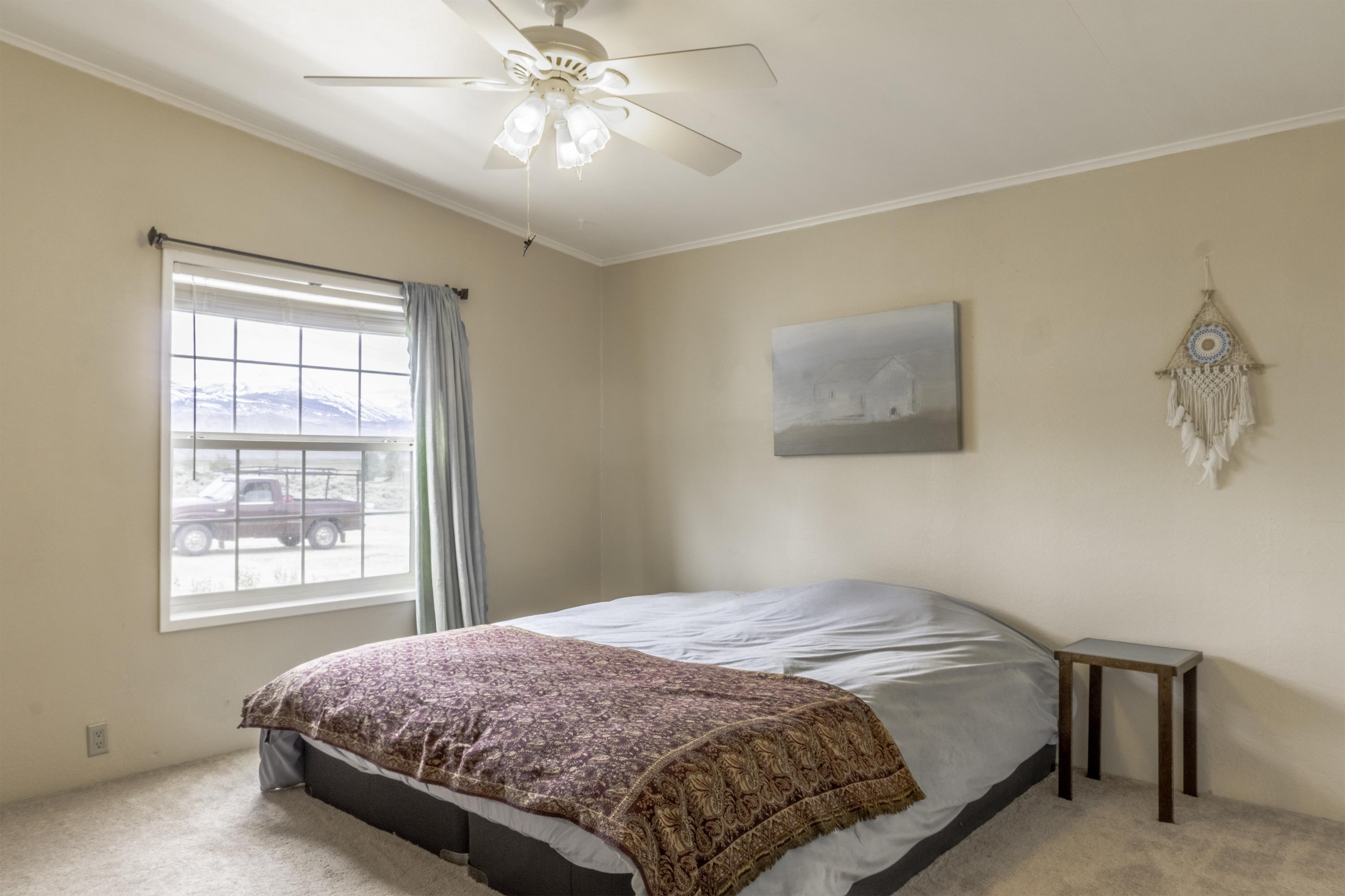 18 Eagle-Peak Bridgeport, CA 93517 - Photo 20 of 45 a bedroom with a large bed and a window