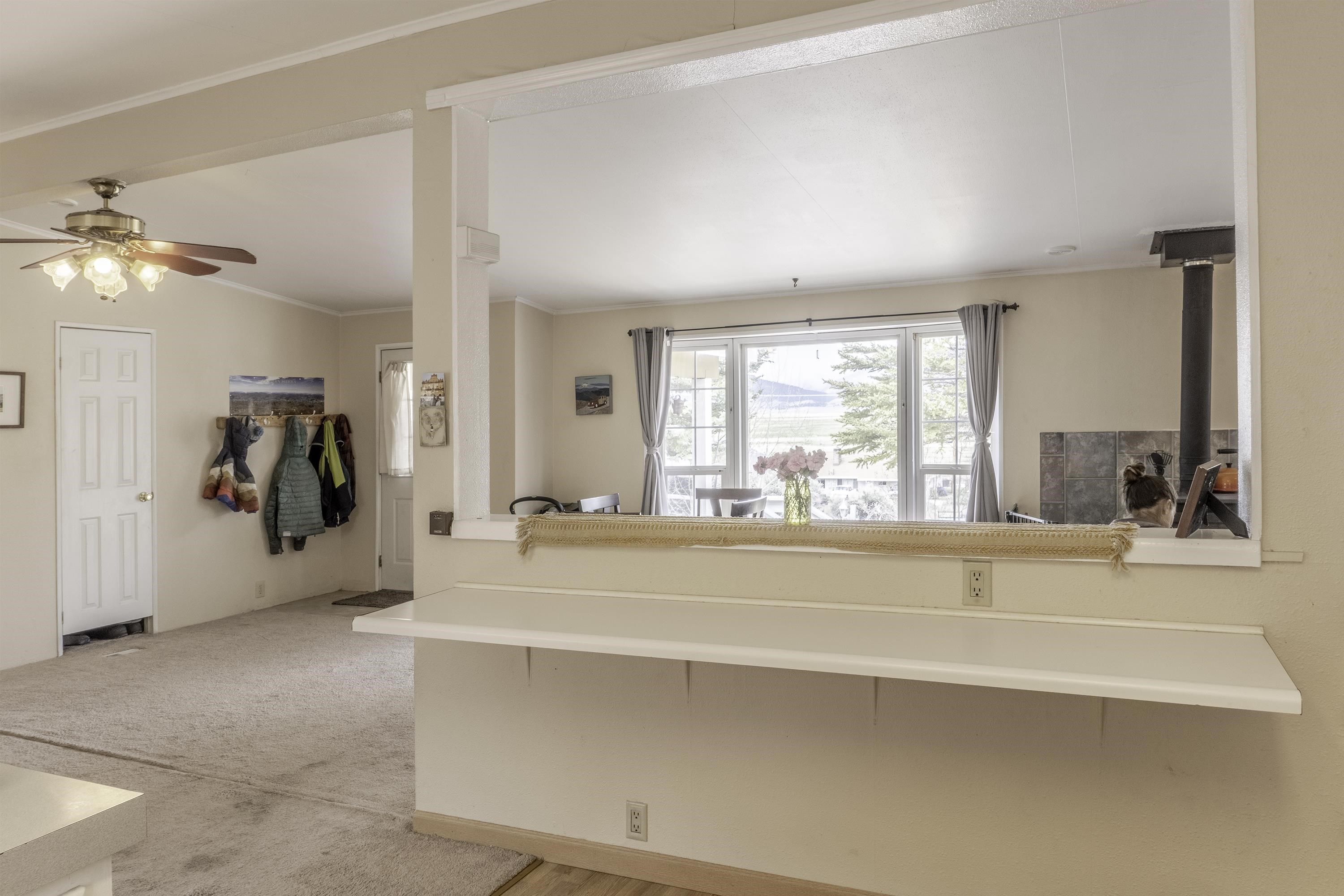 18 Eagle-Peak Bridgeport, CA 93517 - Photo 28 of 45 a living room with kitchen island and a large window with outer view