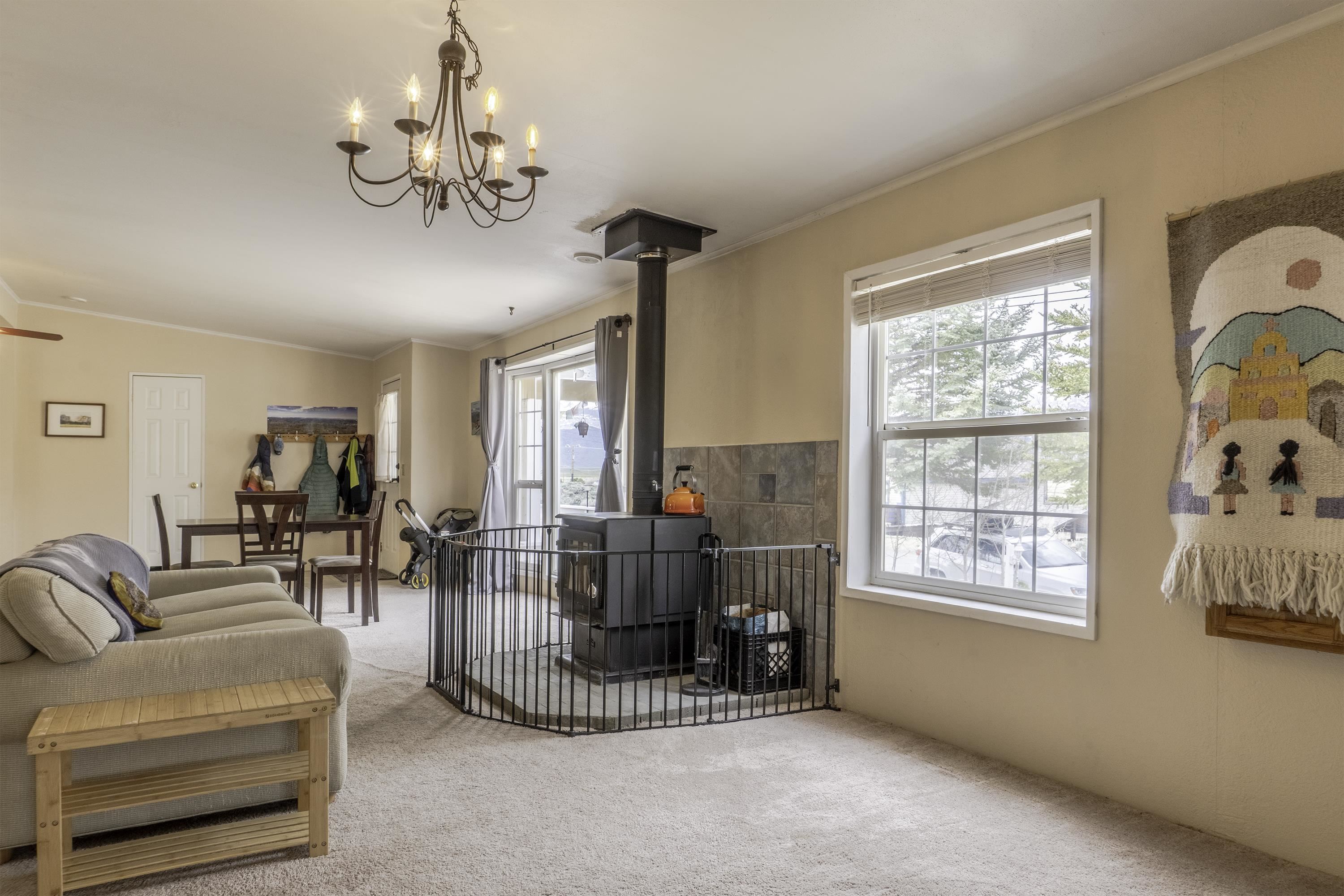18 Eagle-Peak Bridgeport, CA 93517 - Photo 3 of 45 a living room with furniture a chandelier and a window