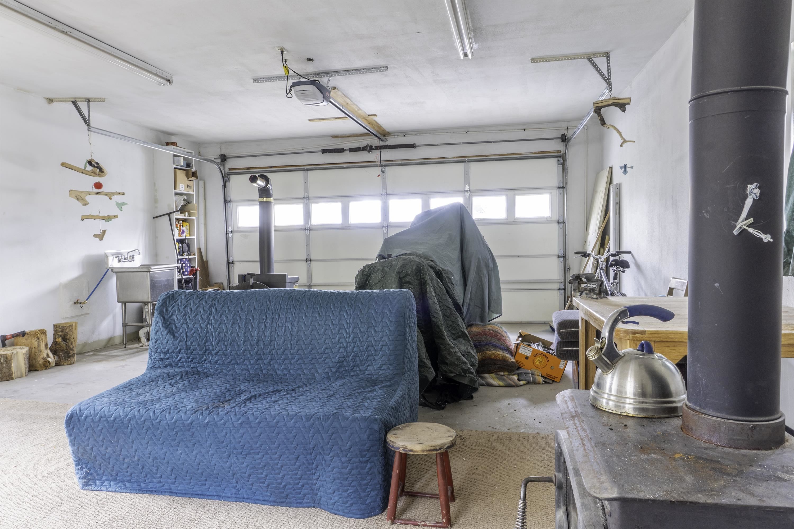 18 Eagle-Peak Bridgeport, CA 93517 - Photo 34 of 45 a living room with furniture gym equipment and a chandelier