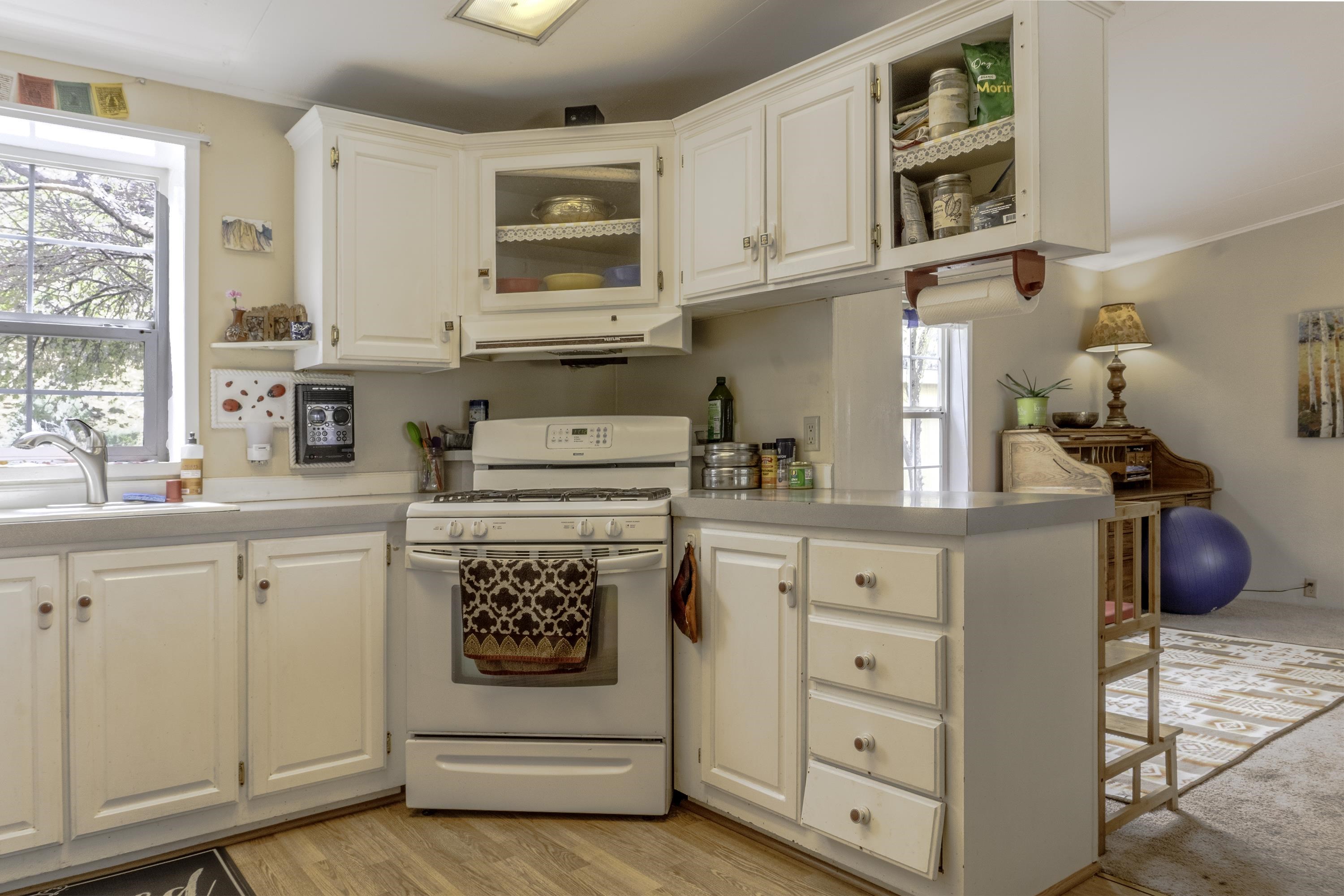 18 Eagle-Peak Bridgeport, CA 93517 - Photo 10 of 45 a kitchen with cabinets and window