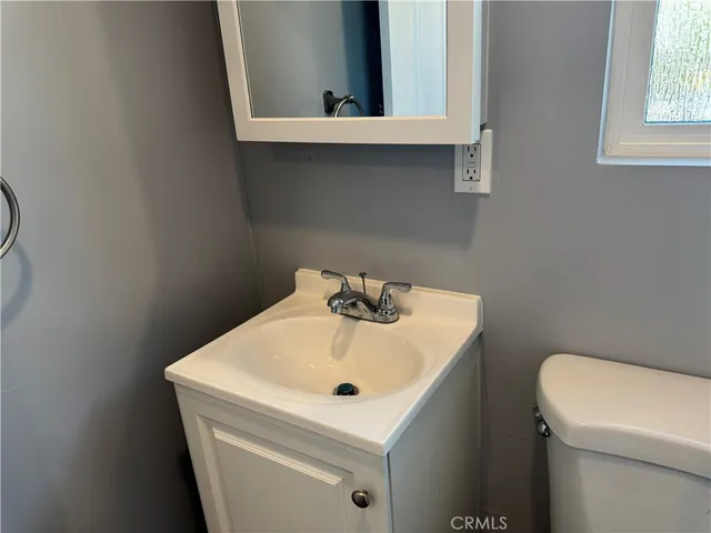 a bathroom with a sink and a toilet