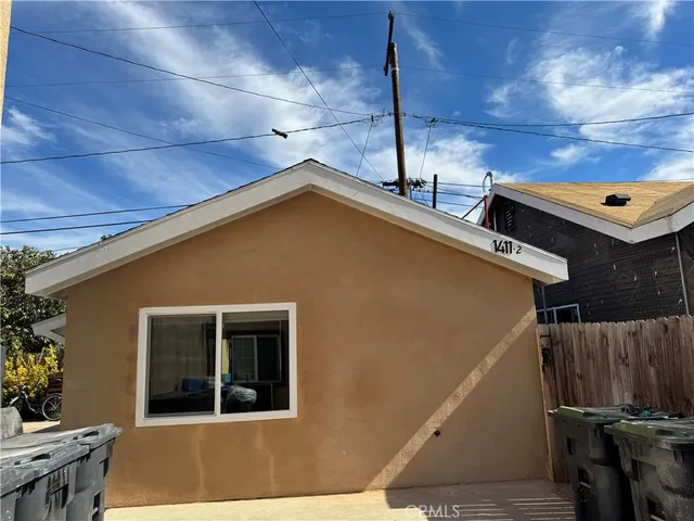 a front view of a house with parking space