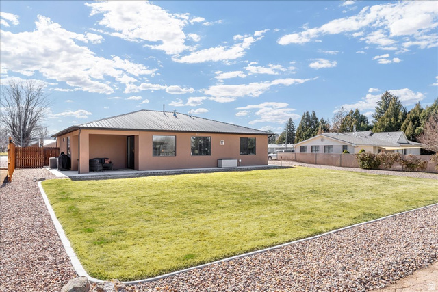357 East Main Street Enterprise, UT 84725 - Photo 59 of 71 Back of property featuring a patio, stucco siding, and a metal roof