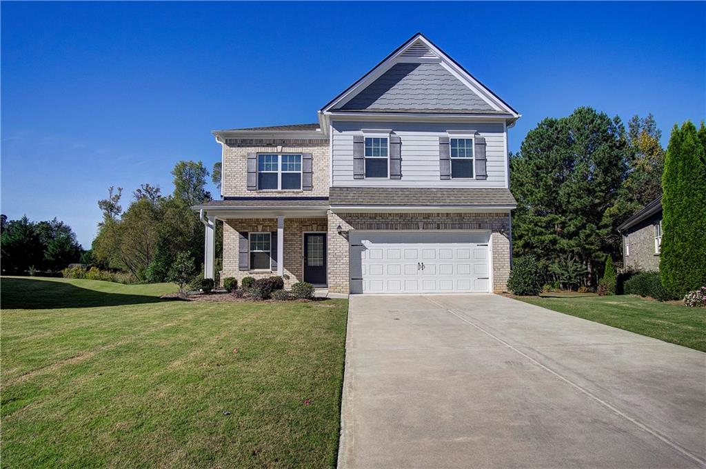 a front view of a house with garden