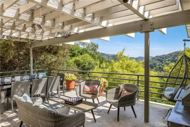 a view of a balcony with chairs