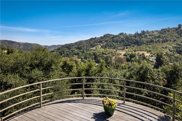 a view of balcony with furniture
