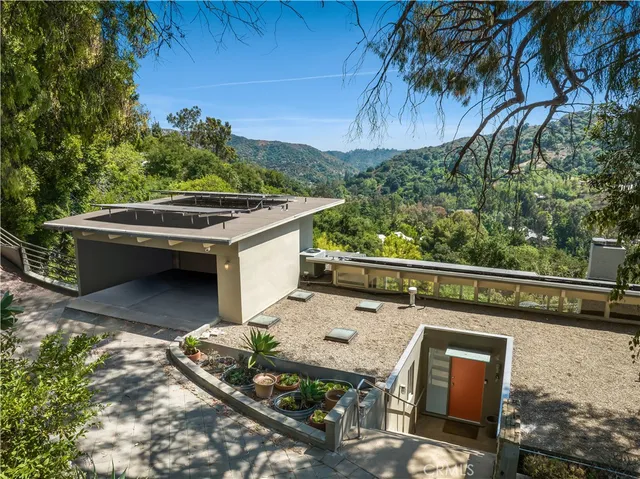 a view of balcony with wooden floor and seating space