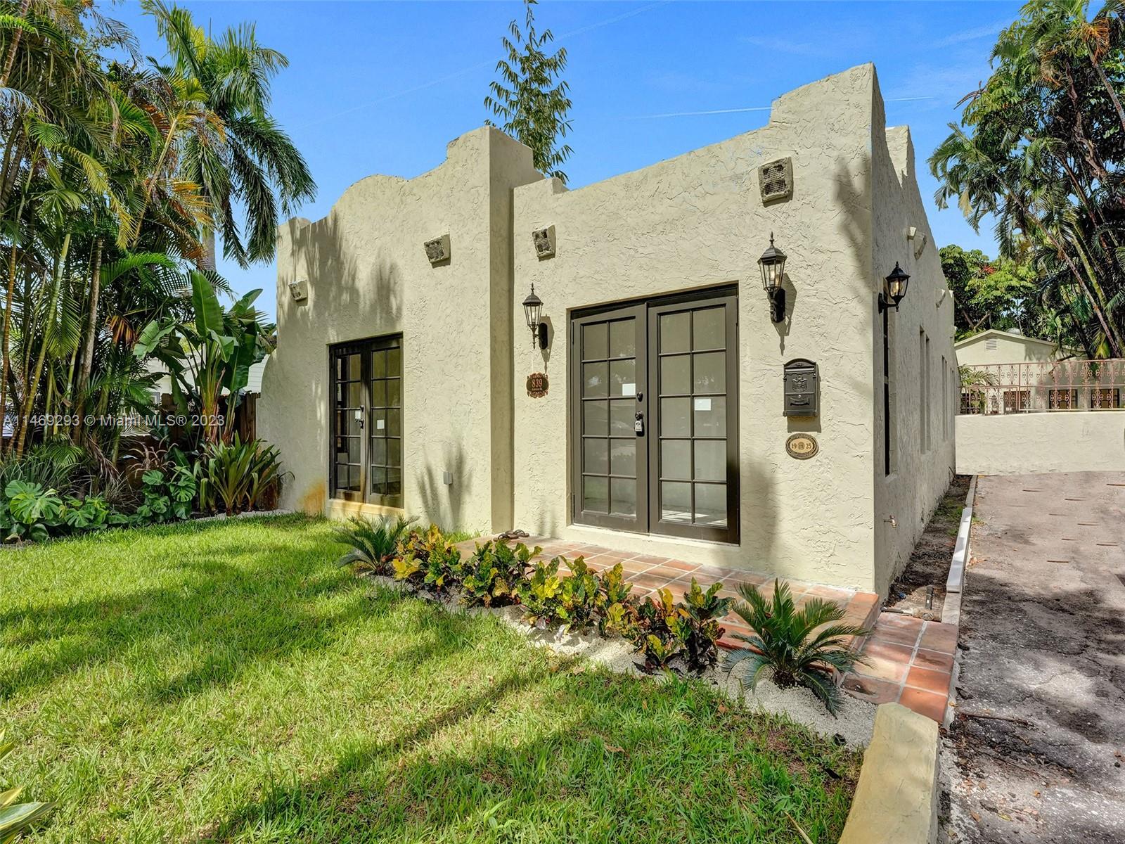 839 Ardmore Road West Palm Beach, FL 33401 - Photo 1 of 53 a front view of a house with a yard