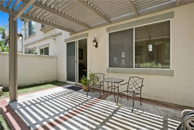 a view of balcony with two chairs and a table