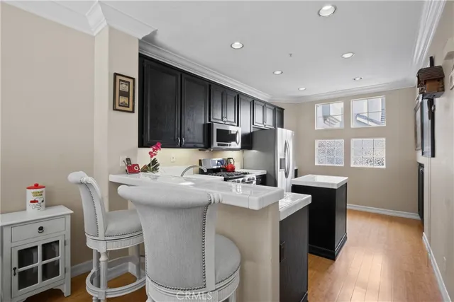 a kitchen with a sink cabinets and window