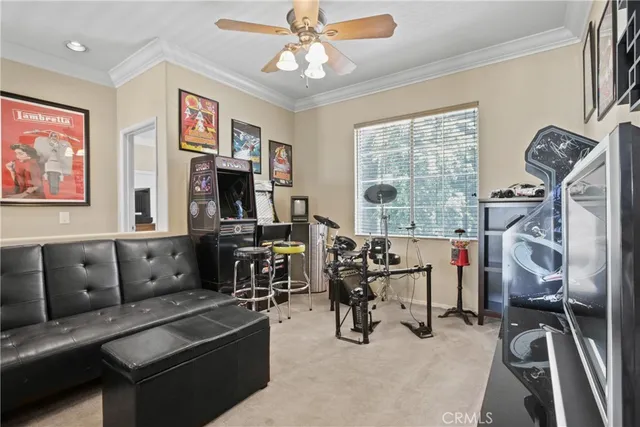 a living room with furniture gym equipment and a window
