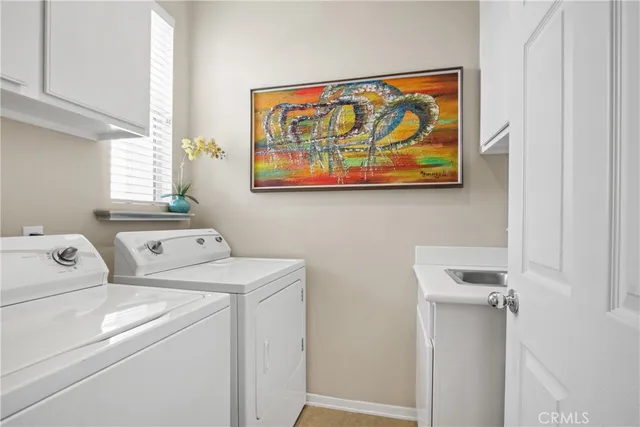 a view of storage and utility room with washer and dryer