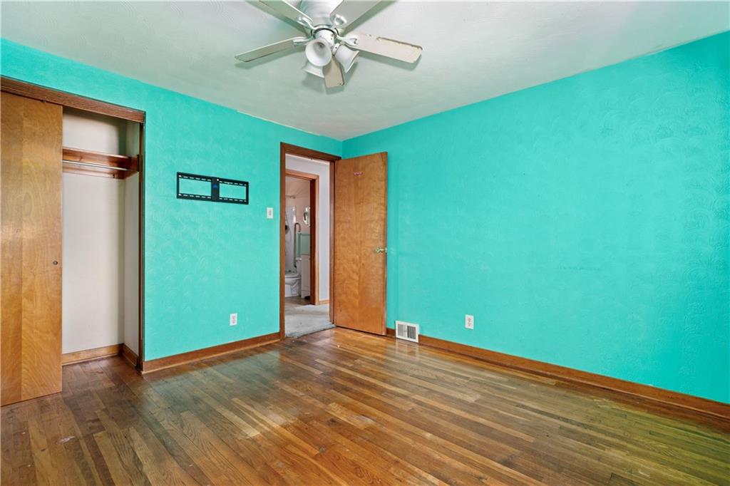 217 Mifflin Street Homestead, PA 15120 - Photo 19 of 26 a view of room with window and wooden floor