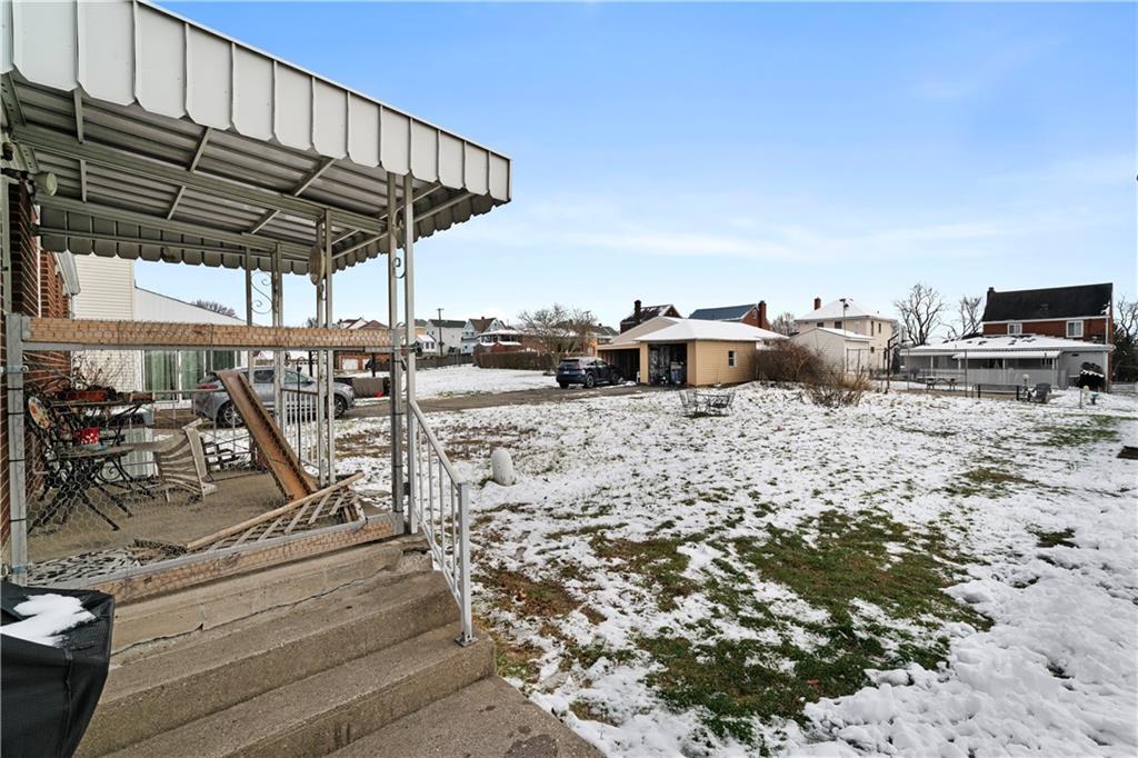 217 Mifflin Street Homestead, PA 15120 - Photo 23 of 26 a view of a patio with a table and chairs