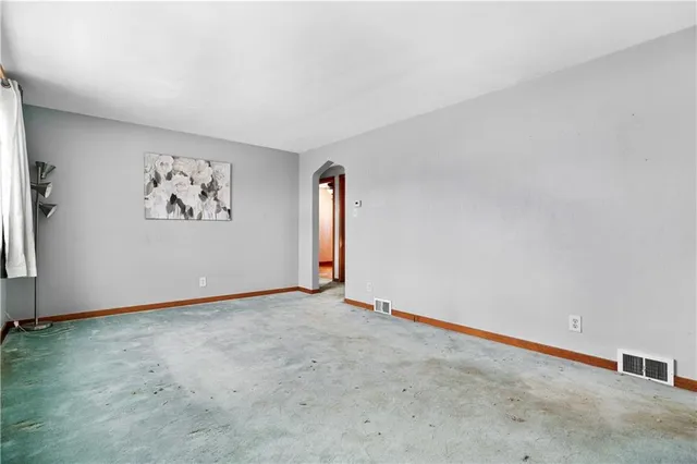 an empty room with windows