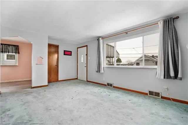 an empty room with windows