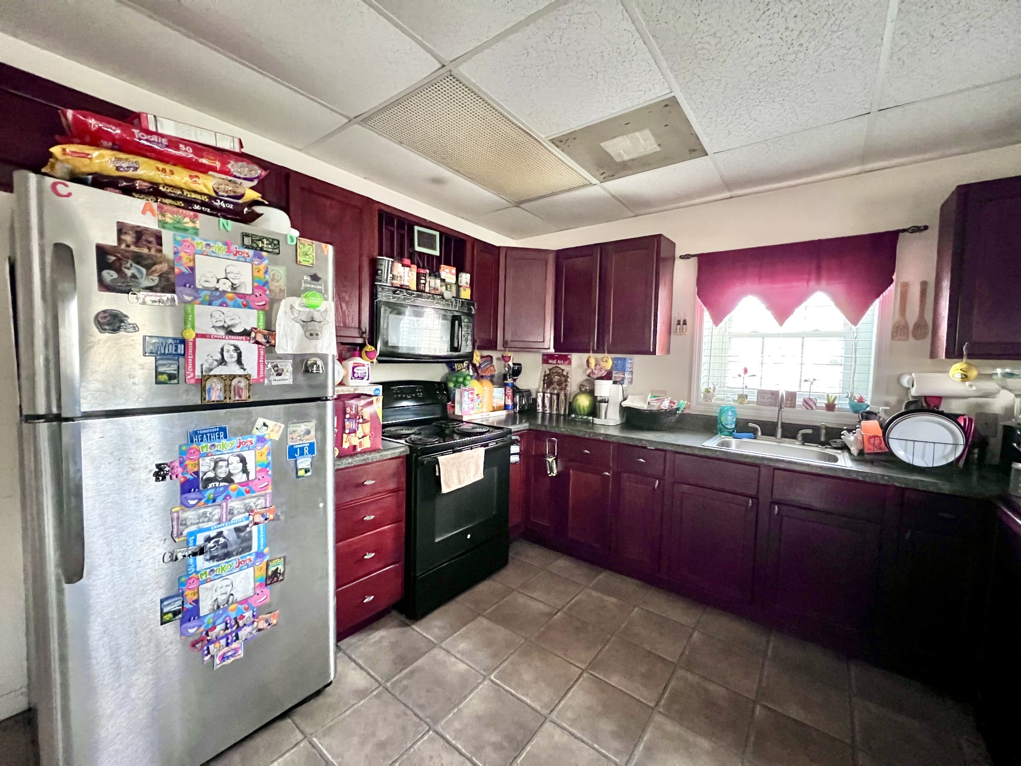9 Ford Road Leoma, TN 38468 - Photo 10 of 19 a kitchen with granite countertop a refrigerator and a sink