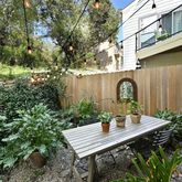 a view of a backyard with sitting area and furniture