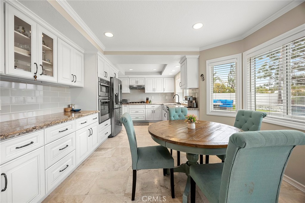 6 Sand Pointe Laguna Niguel, CA 92677 - Photo 20 of 49 a kitchen with granite countertop white cabinets and stainless steel appliances