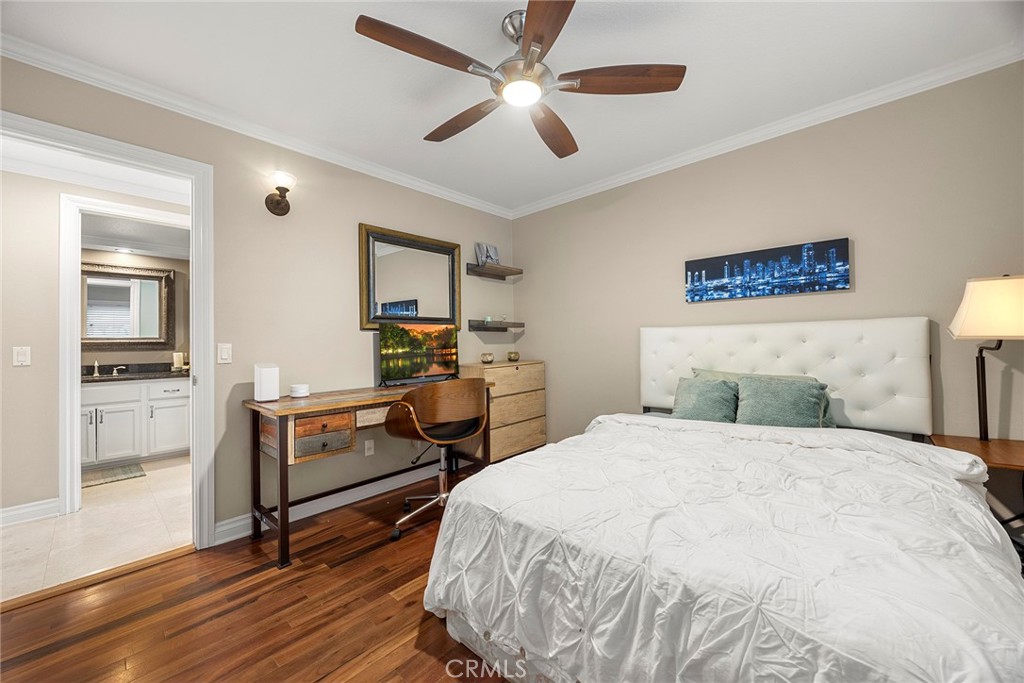 6 Sand Pointe Laguna Niguel, CA 92677 - Photo 28 of 49 a bedroom with a bed and a chandelier