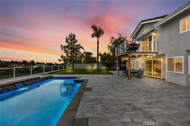 a view of a roof deck with couches and sky view