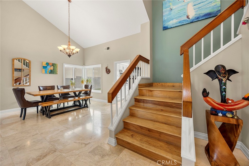 6 Sand Pointe Laguna Niguel, CA 92677 - Photo 10 of 49 a living room with furniture and a chandelier