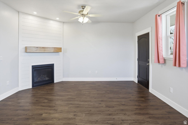 1009 High Creek Road Cove, UT 84320 - Photo 58 of 79 ADU living room with dark wood-style floors, a large fireplace, recessed lighting, and a ceiling fan