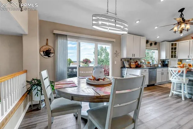 a view of a dining room with furniture window and outside view