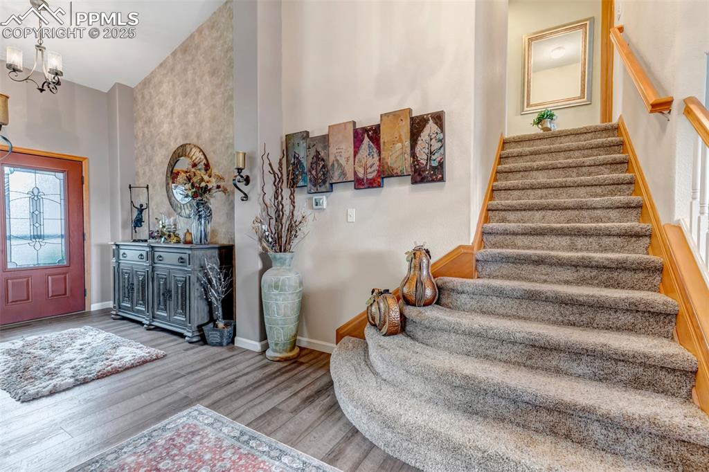 7120 Highcroft Drive Colorado Springs, CO 80922 - Photo 2 of 50 a view of entryway and hall with wooden floor