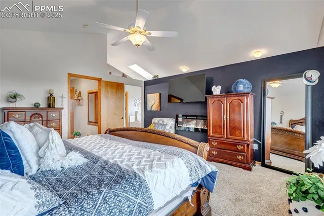 a bedroom with bed and wooden floor