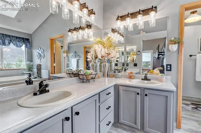 a bathroom with a sink double vanity and a mirror