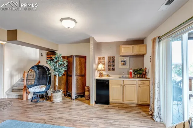 a kitchen with stainless steel appliances a stove refrigerator and cabinets