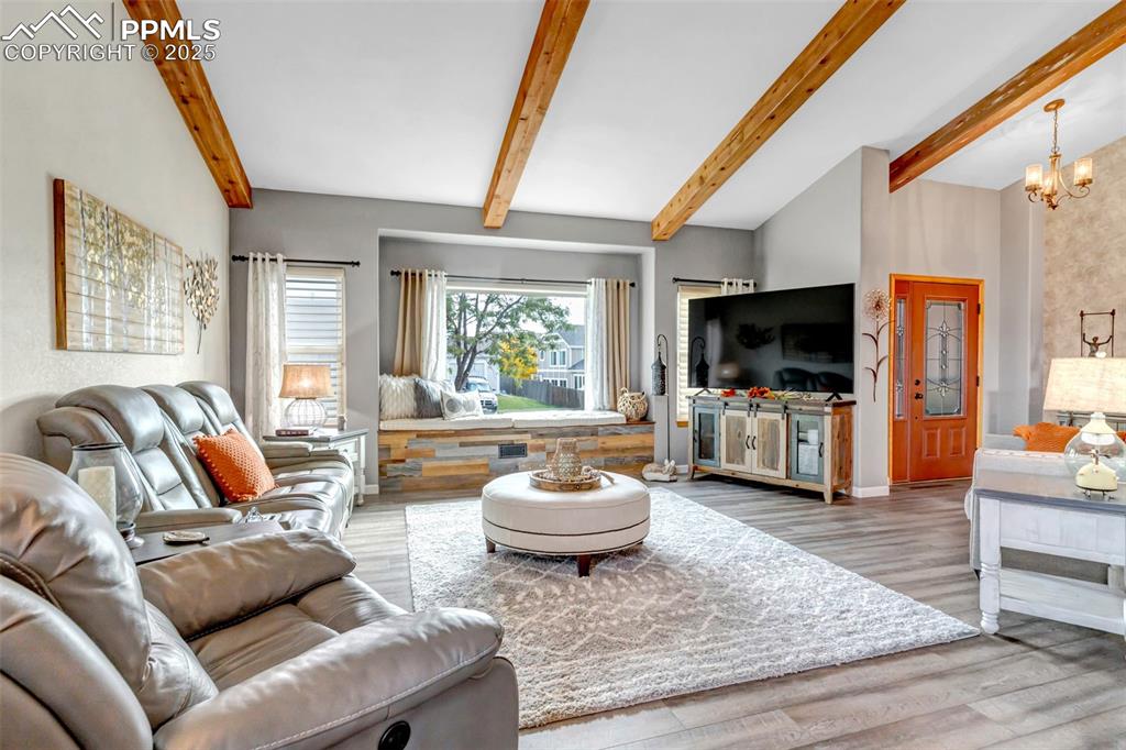 7120 Highcroft Drive Colorado Springs, CO 80922 - Photo 4 of 50 a living room with furniture and a flat screen tv