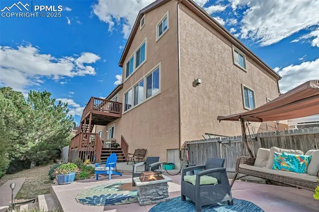 a house view with couches and a fire pit
